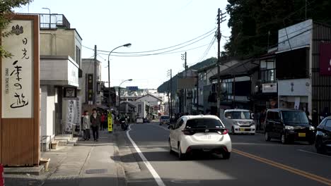 Japanese-national-route-119-traffic-flows-through-busy-urban-high-street