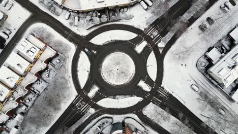 Traffic-circle-road,-sunny-winter,-aerial-drone-rotation-stock-video