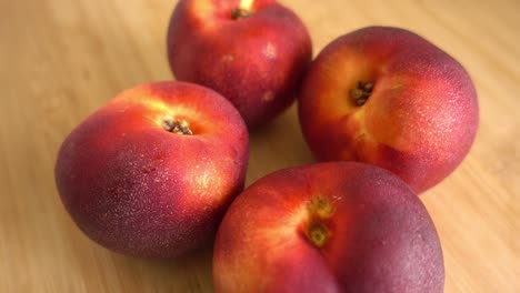 Freshly-picked-ripe-peaches-Rotating