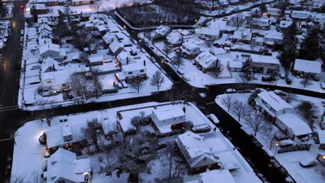 An-aerial-view-over-a-suburban-neighborhood-on-a-cloudy-morning-after-the-first-snowfall-for-2024-in-NY