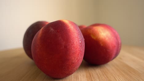 Freshly-picked-ripe-peaches-Rotating