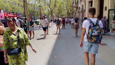 Young-Man-With-Backpack-Walking-Amongst-People-On-Very-Busy-Streets-|-Barcelona-Spain-Immersive-City-Walk-Through-Crowded-Streets-in-Gothic-Quarter,-Europe,-4K