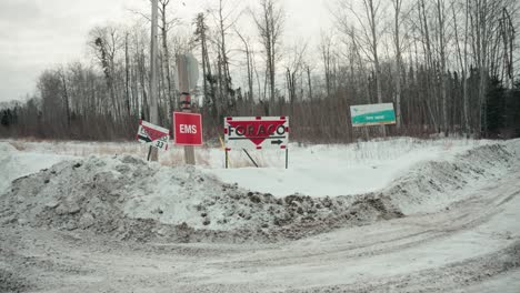 A-Group-of-Warning-Signs-Foraco-Highway-Billboard-Sign-for-Vale-Pipe-Mine-Employee-Road-Exit-Near-Thompson-Manitoba-Northern-Canada