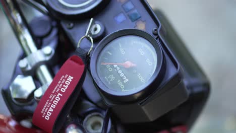 Close-Up-Retro-Motorcycle-Speedometer-and-Key