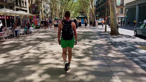 Man-In-Muscle-Shirt-Walking-Near-Women-In-Busy-Plaza-|-Barcelona-Spain-Immersive-City-Walk-Through-Crowded-Streets-in-Gothic-Quarter,-Europe,-4K