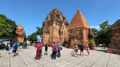 Tourists-happily-take-photos-at-the-famous-Ponagar-Cham-Towers-in-Nha-Trang,-Vietnam