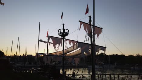 Decorated-scary-party-pirate-boat,-called-Sánta-Róza-at-sunset-in-Balatonfüred-marina,-Hungary
