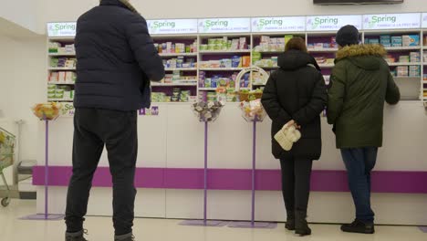 Pharmacy.-People-Waiting-At-Drugstore-Shop-Counter