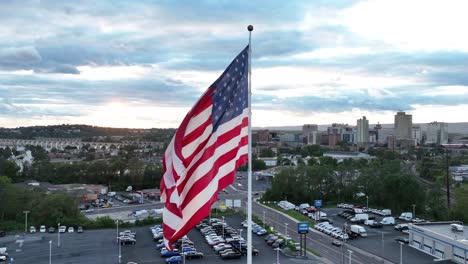 American-flag-waving-over-Harrisburg-skyline-during-sunset
