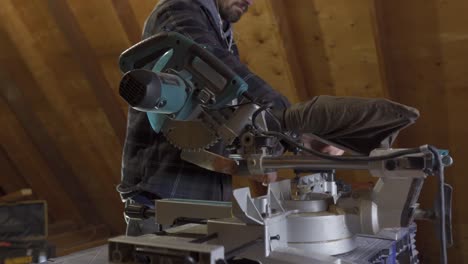 Renovation-Carpenter-Cutting-Wood-On-A-Mitre-Saw