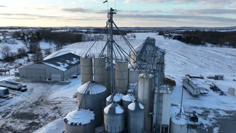 Grain-elevator-bins-and-storage-in-winter-snow-scene