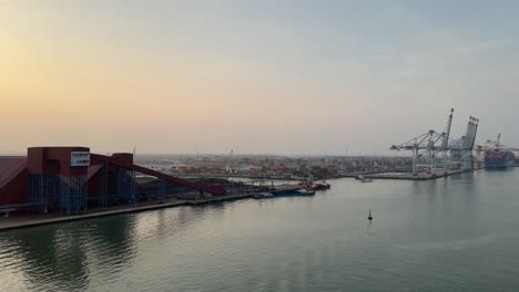 View-of-giant-cargo-cranes-and-gentle-breeze-of-water-ripples-in-Port-of-Phu-My,-Vietnam