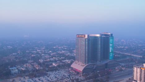 Heavy-smog-in-Pakistan---Aerial-view-of-Centaurus-Mall-at-dusk,-Islamabad