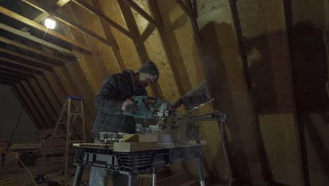 Carpenter-Cutting-And-Measuring-Wood-On-A-Construction-Site