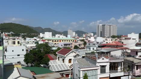 Panning-high-angle-view-shot-of-houses-and-buildings-in-Nha-Trang-City,-Vietnam