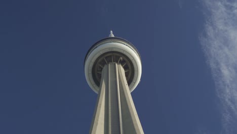 Low-angle-view-of-the-CN-Tower-in-Toronto,-Canada-against-a-clear-blue-sky,-highlighting-its-iconic-structure