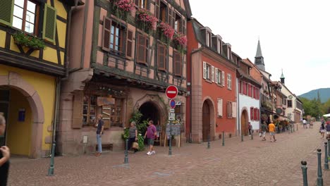 French-People-Walk-Around-Kayserberg-Village-Filled-With-Half-Timbered-Colourful-Houses