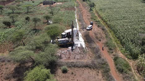 Drilling-well-to-supply-African-farmland-with-water,-Kenya,-aerial