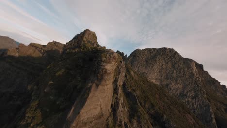 FPV-drone-cruising-in-the-mountains-in-proximity-to-the-ridgeline-over-the-clouds-at-Madeira