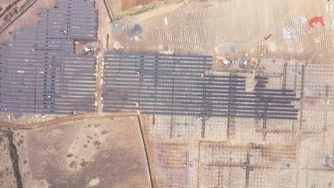 Aerial-drone-view-moving-forward-showing-lots-of-power-solar-power-panel-power-plan