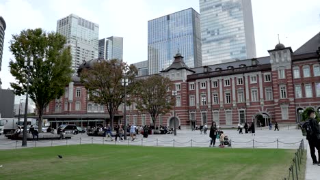 Tokyo-Station-Central-Seen-From-Marunouchi-Square-With-People-Enjoying-And-Relaxing-Nearby