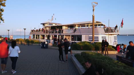 Tourists-embarking-into-the-catamaran-ship-at-Balatonfüred,-Lake-Balaton-in-Hungary