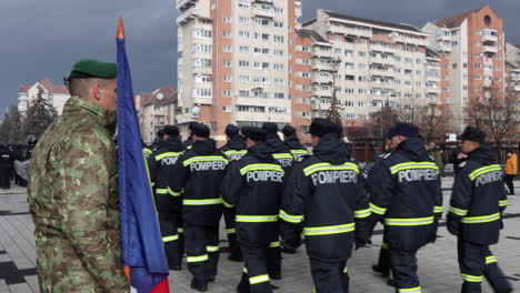Romanian-police,-SMURD-team-in-orange-uniforms-march-in-Miercurea-Ciuc-parade