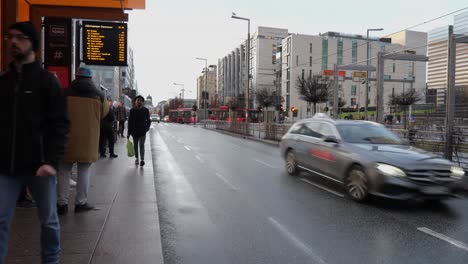 Bus-stop-on-the-Barcode-area-of-downtown-Oslo,-Norway-on-a-cold,-wet-winter's-day