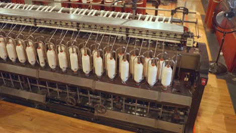 Close-up-shot-of-Cotton-Spinning-Machine-kept-in-Science-and-industry-museum-in-Manchester,-England