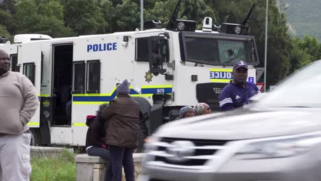 Township-bystanders-in-front-of-RG-12-Police-vehicle-at-crime-scene