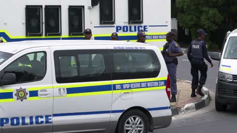 Public-order-police-and-vehicles-outside-township-in-South-Africa