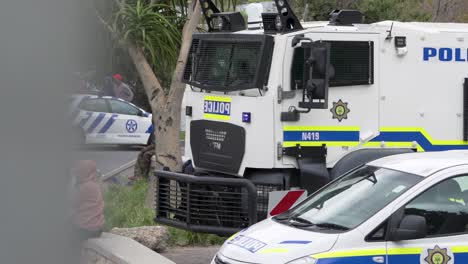 SA-Public-Order-Police-Unit-vehicles-with-flashing-lights-outside-tense-township