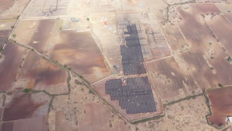 Aerial-wide-angle-view-showing-lots-of-solar-panels-and-power-plants