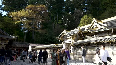 People-leisurely-stroll-in-the-vicinity-of-the-Karamon-Gate-at-Nikko-Toshogu,-Japan,-adding-a-lively-touch-to-the-cultural-ambiance-of-this-revered-site