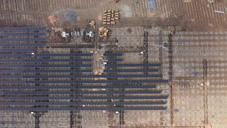 Aerial-drone-view-Drone-camera-moving-upwards-showing-a-large-solar-power-plant