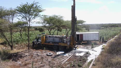 Rig-drilling-well-to-supply-corn-plantation-with-water,-Kenya