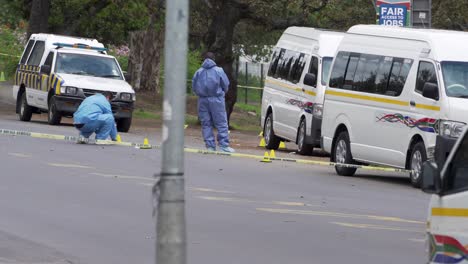 Forensic-detectives-scrutinize-homicide-scene-in-ongoing-taxi-violence
