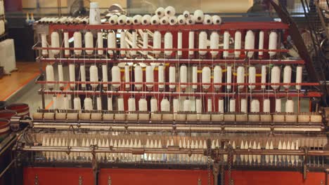 Parallax-close-up-shot-of-Cotton-spinning-machine-at-Science-and-Industry-museum-in-Manchester,-England