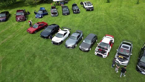 Aerial-view-of-Enthusiasts-Sport-Car-Meet-on-Grass-in-Public-Park---car-culture