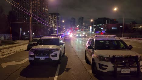 Convoy-of-Cop-Cars-Lined-Up-Outside-Murderous-Crime-Scene