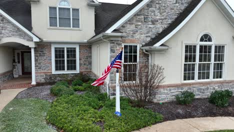 American-flag-in-front-of-a-large-modern-home