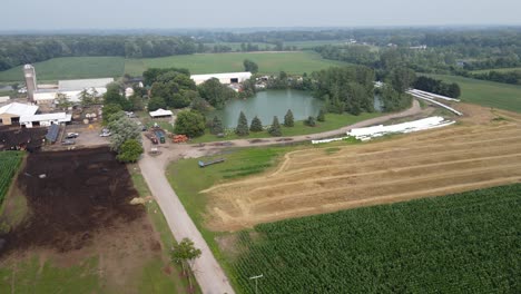 Calder-Dairy-Farm-facility,-local-and-small-dairy-farm-in-Michigan,-USA,-aerial-view