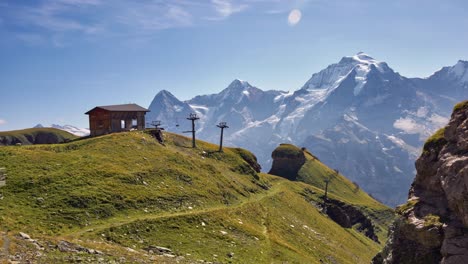 Stunning-green-meadows-at-top-of-ski-resort-in-the-summer-overlook-mountain-vista-in-high-alpine-zone