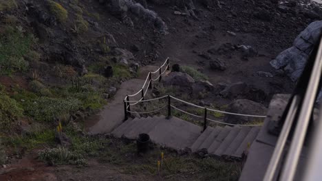 Scary-dark-ancient-staircase-leads-to-black-volcanic-beach