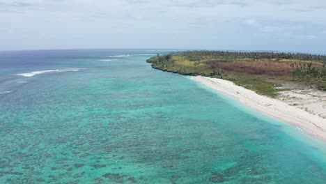 Aerial-View,-Scenic-Tropical-Island-Coastline-and-Coral-Reefs,-Tonga,-Polynesia