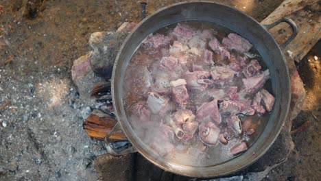 Pork-ribs-made-in-a-pot-on-firewood