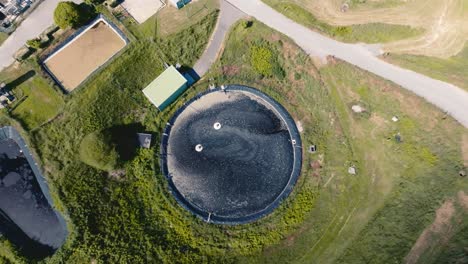 Wastewater-recovery-basin,-water-is-darkened-before-filtration