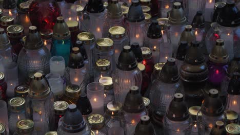 Memory-Candles-and-votive-lights-standing-in-cementary-during-All-Saints'-Day