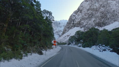 South-Island,-New-Zealand---Traveling-Along-a-Road-on-a-Winter-Day-in-Fiordland-National-Park---POV