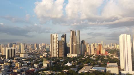 Wide-drone-shot-of-Makati-City-Skyline,-Philippines